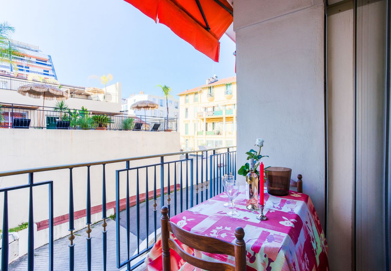 SMALL BALCONY WITH TABLE ON THE SIDE ROOM WITH 2 BEDS