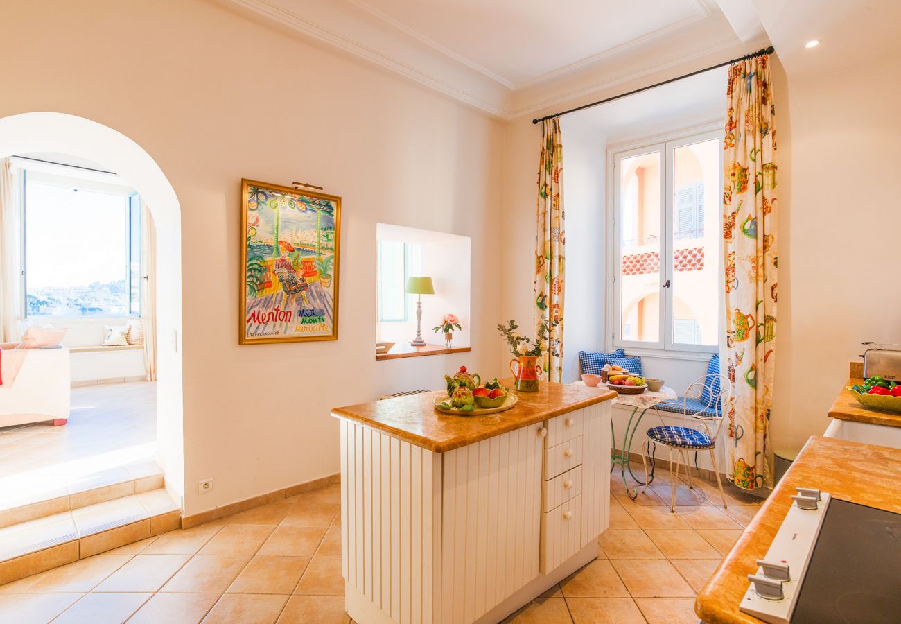 The kitchen overlooking the living-dining room