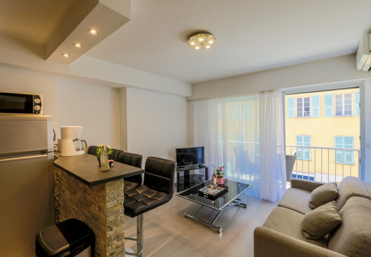 Living room with television and kitchen