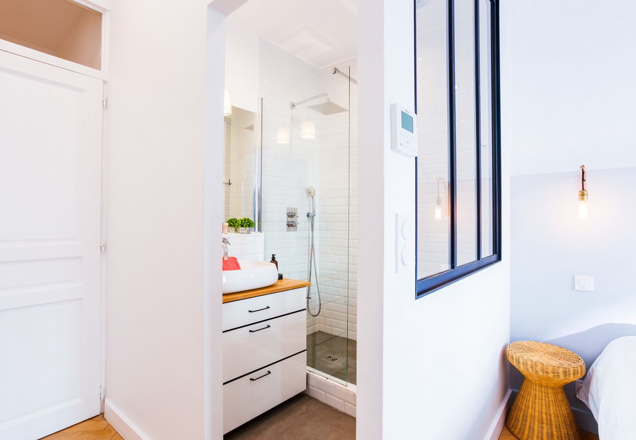 The bathroom with shower adjoining the bedroom