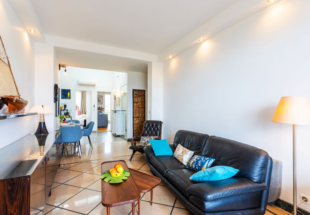 living room opening onto terrace with sea view