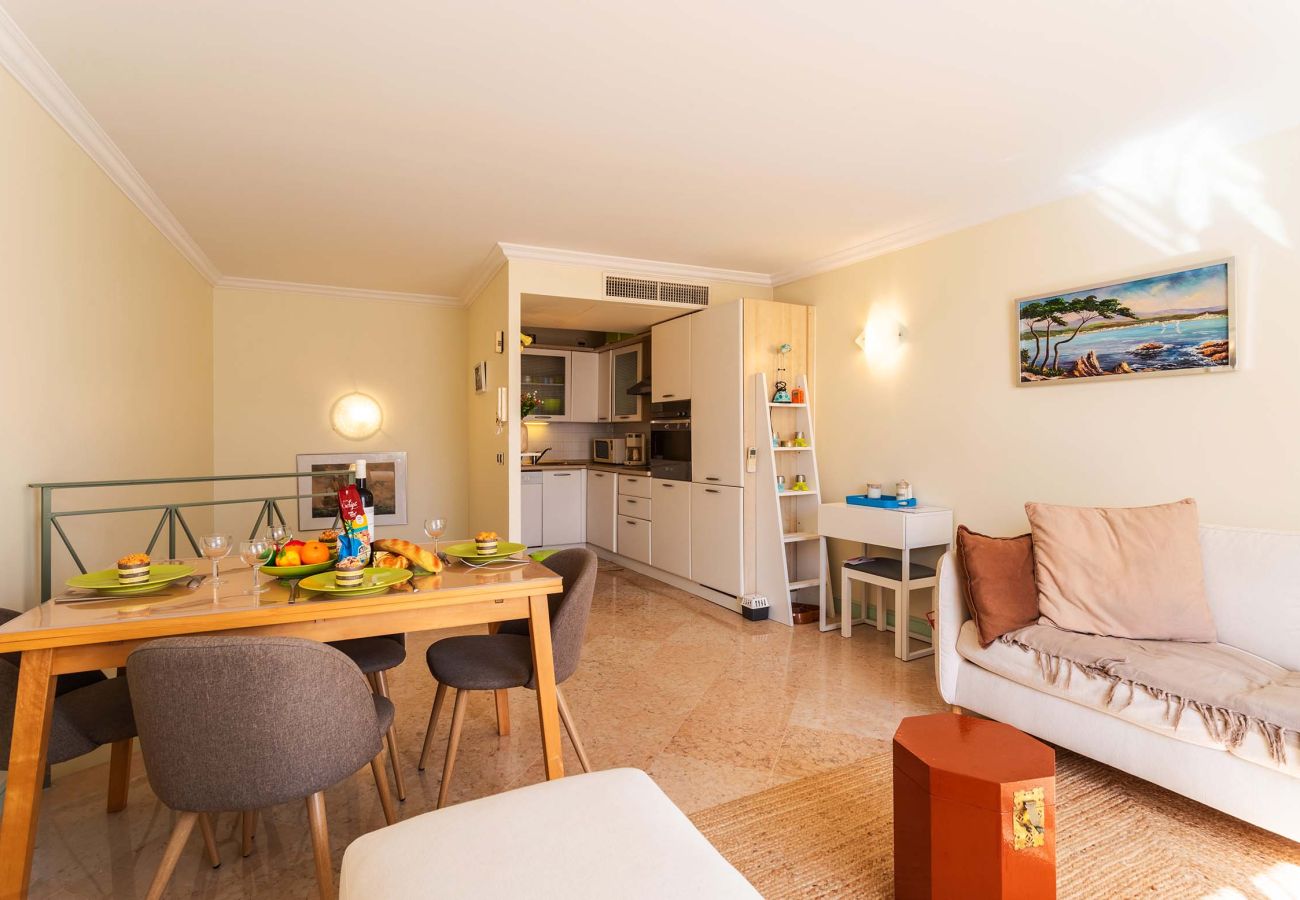 Open kitchen, cozy dining area, and bright living space. Practical and inviting