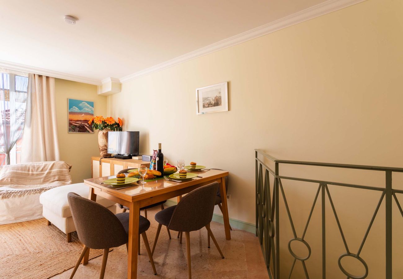 Bright dining area, perfect for sharing a cozy meal around a carefully set table.