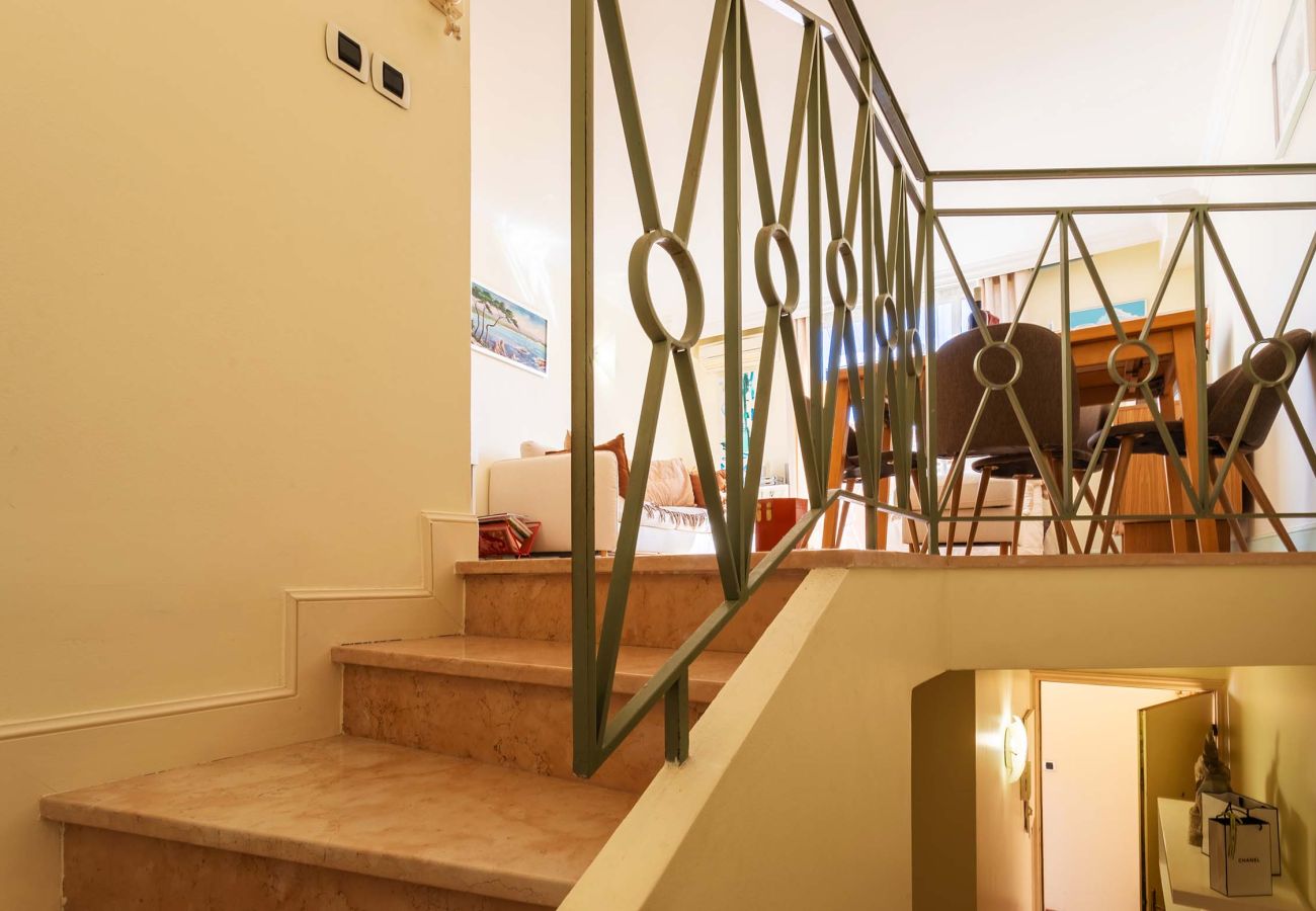 Chic staircase leading to the master bedroom, ensuring privacy and comfort in a serene setting.