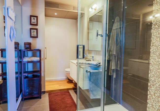 BATHROOM WITH SHOWER AND TOILET THE BATHROOM WITH SHOWER AND TOILET